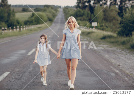 mom and daughter outside 25613177