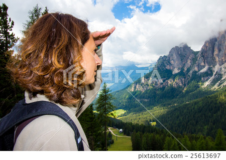 Woman looks the mountain landscape 25613697