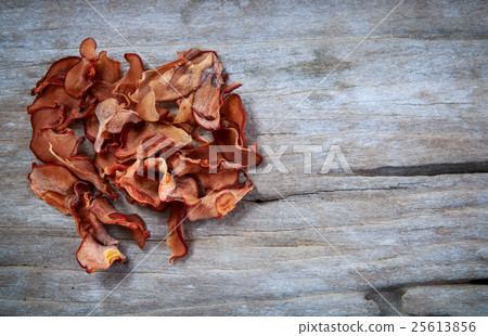 Garcinia cambogia fresh fruit on wood background. Garcinia cambogia fresh fruit on wood background. 25613856