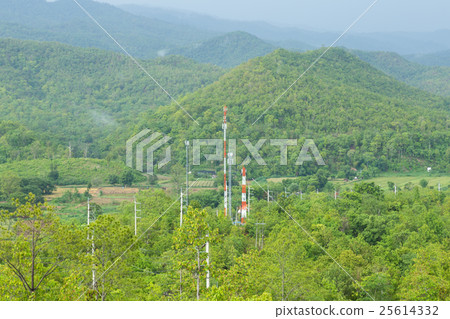 Telecommunications towers in forest 25614332