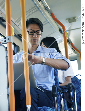Bus commuting businessman Bus commuting businessman 25616083
