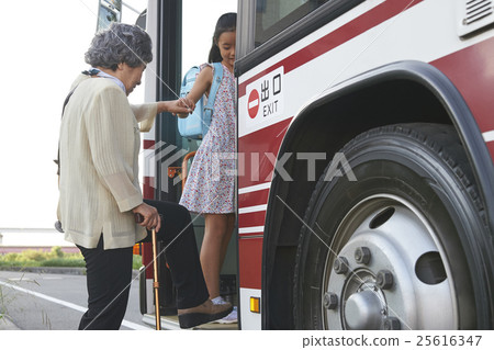 Bus inside grandma and granddaughter 25616347
