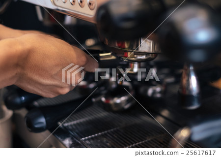 Hand preparing a fresh coffee at cafe. close up. Hand preparing a fresh coffee at cafe. close up. 25617617