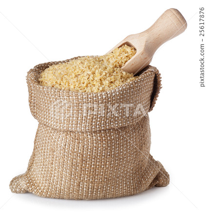 Bulgur in bag with wooden scoop isolate 25617876