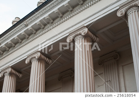 tall white columns of the building facade 25618054