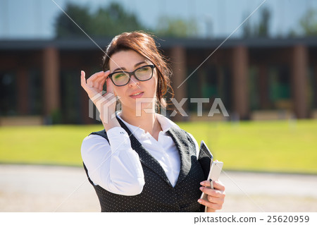 Portrait of a young smiling business woman 25620959