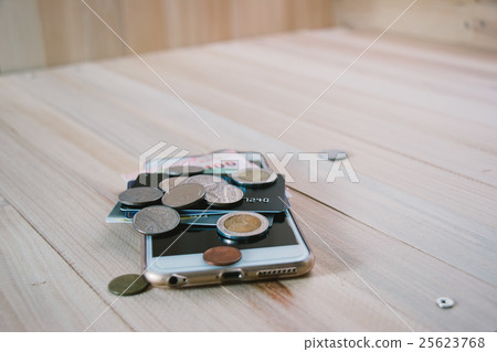 Credit card,  plastic money, put on smartphone. 25623768