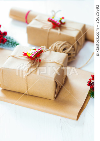 Christmas gift and a sprig of pine needles  25625992