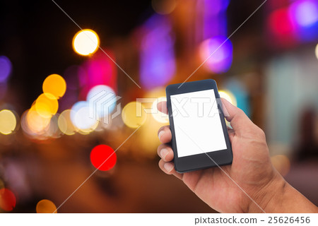 Hand man with smart phone mobile on night city 25626456