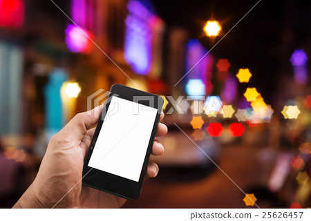 Hand man with smart phone mobile on night city 25626457