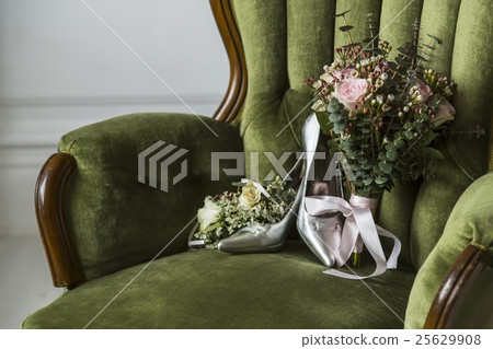 Shoes with a wedding bouquet 25629908