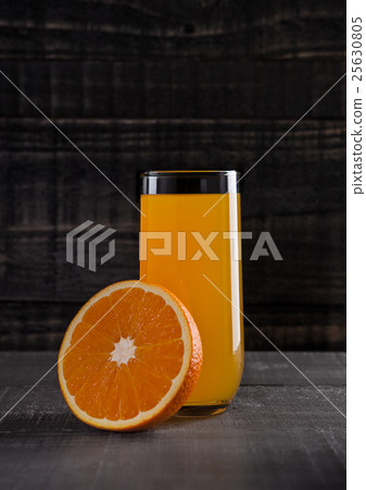 Glass of healthy orange juice with fruit on wood Glass of healthy orange juice with fruit on wood 25630805