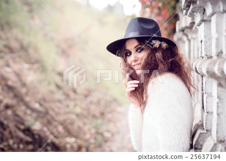 Beautiful girl on brick wall background 25637194