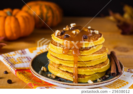 Pumpkin pancakes with caramel sauce. Breakfast 25638012