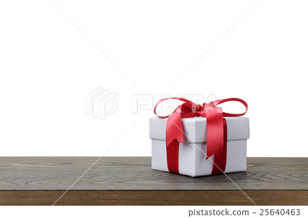 gift box with red bow on rustic table gift box with red bow on rustic table 25640463