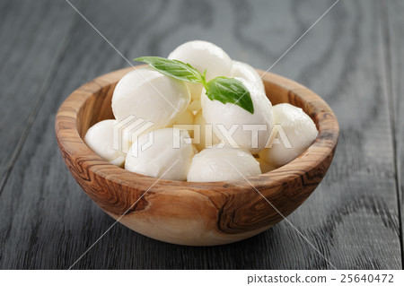 small balls of mozzarella in bowl small balls of mozzarella in bowl 25640472