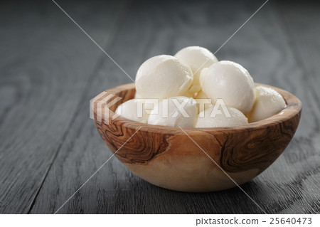 small balls of mozzarella in bowl small balls of mozzarella in bowl 25640473
