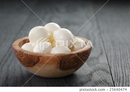 small balls of mozzarella in bowl small balls of mozzarella in bowl 25640474