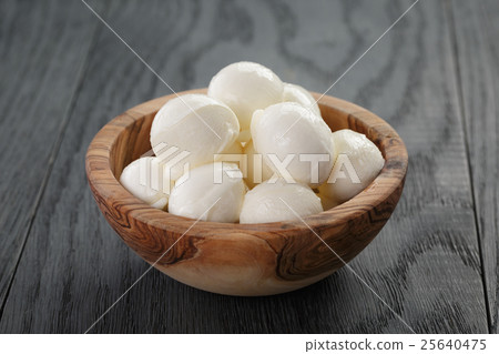 small balls of mozzarella in bowl small balls of mozzarella in bowl 25640475