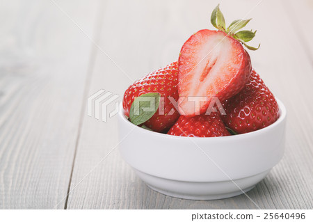 ripe strawberries on an old wooden table ripe strawberries on an old wooden table 25640496