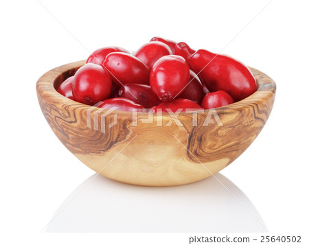 fresh bogwood berries in wood bowl isolated on white fresh bogwood berries in wood bowl isolated on white 25640502