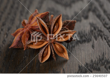 anise stars on old oak table close up photo anise stars on old oak table close up photo 25640507