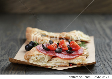 sandwich with pita bread salami and vegetables on wood table sandwich with pita bread salami and vegetables on wood table 25640574