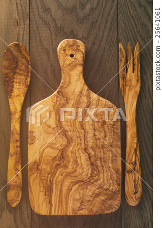 composition with olive wood board on top of oak 25641061