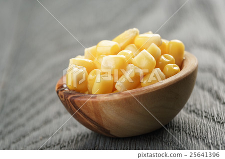 sweet canned corn in wood bowl on wood table 25641396