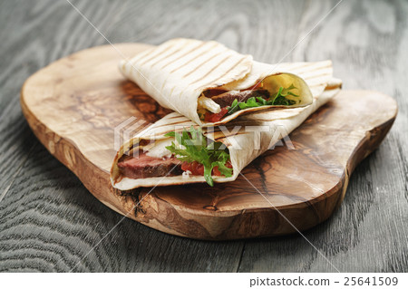 fresh homemade burritos with beef on olive 25641509