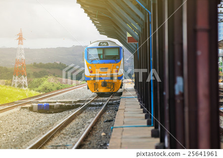 Train on railway track in station. 25641961