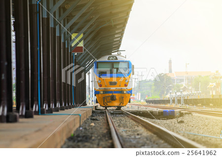 Train on railway track in station. Train on railway track in station. 25641962