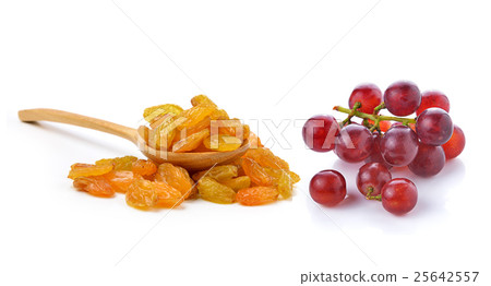 Dried raisins in the wood spoon and grapes Dried raisins in the wood spoon and grapes 25642557