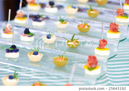 Plates with assorted finger food snacks Plates with assorted finger food snacks 25643192