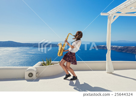 Girl,  saxophone and  sea 25644324
