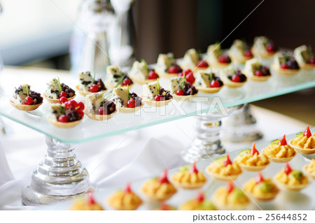 Plates with assorted snacks on an event party 25644852