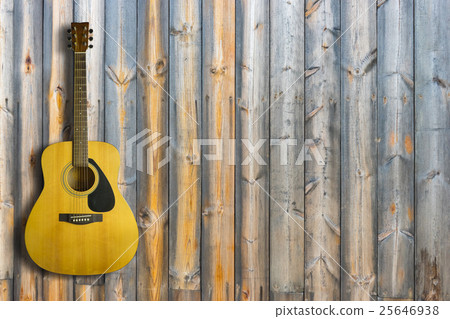 Acoustic guitar on wooden background texture Acoustic guitar on wooden background texture 25646938