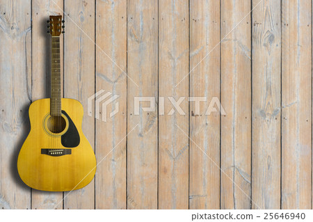 Acoustic guitar on wooden background texture Acoustic guitar on wooden background texture 25646940