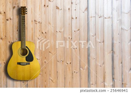 Acoustic guitar on wooden background texture Acoustic guitar on wooden background texture 25646941