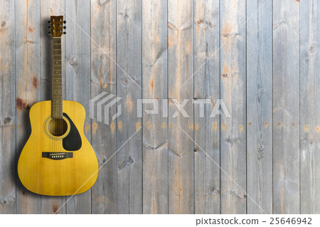 Acoustic guitar on wooden background texture Acoustic guitar on wooden background texture 25646942