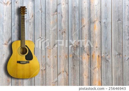 Acoustic guitar on wooden background texture Acoustic guitar on wooden background texture 25646943
