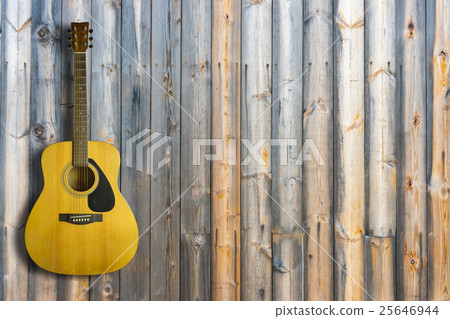 Acoustic guitar on wooden background texture Acoustic guitar on wooden background texture 25646944