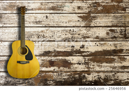 Acoustic guitar on wooden background texture Acoustic guitar on wooden background texture 25646956