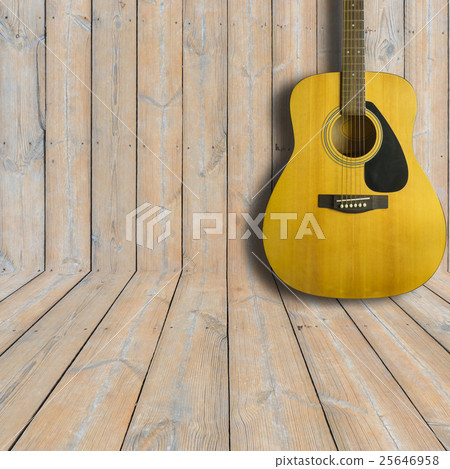 Acoustic guitar on wooden background texture 25646958