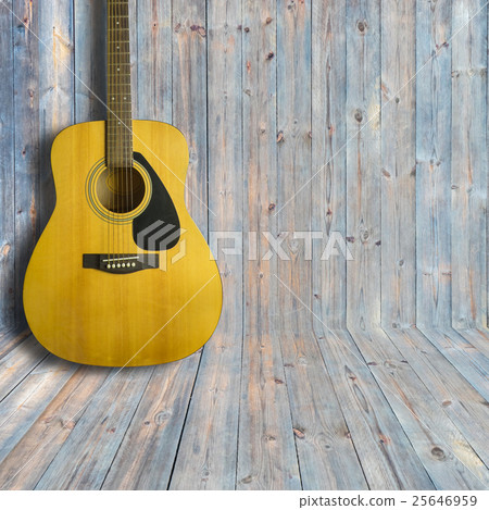 Acoustic guitar on wooden background texture Acoustic guitar on wooden background texture 25646959