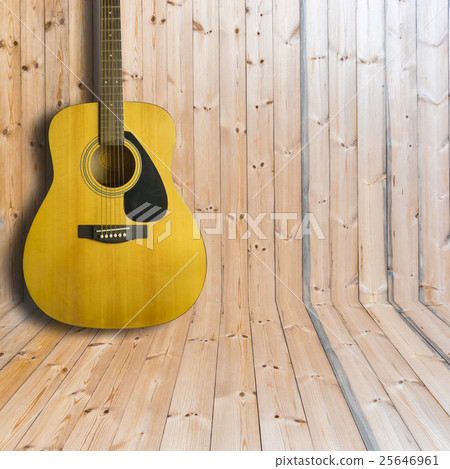 Acoustic guitar on wooden background texture 25646961
