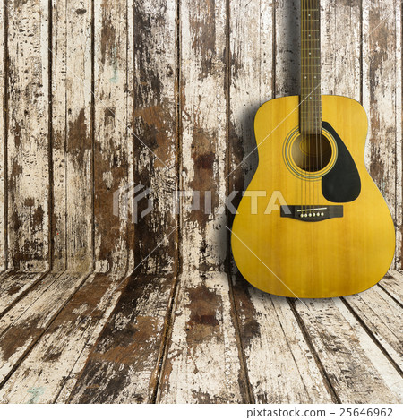 Acoustic guitar on wooden background texture Acoustic guitar on wooden background texture 25646962