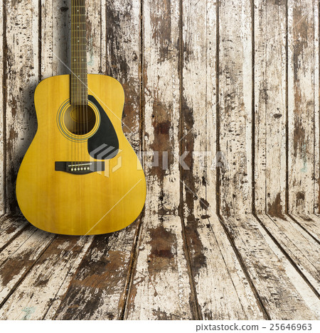 Acoustic guitar on wooden background texture Acoustic guitar on wooden background texture 25646963