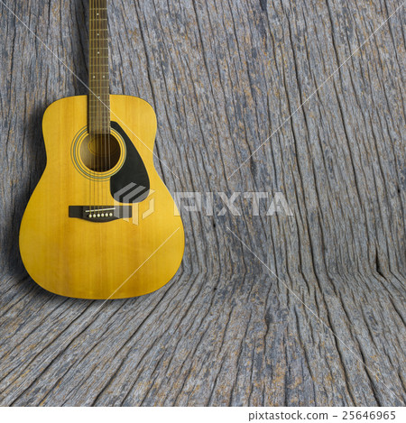 Acoustic guitar on wooden background texture Acoustic guitar on wooden background texture 25646965