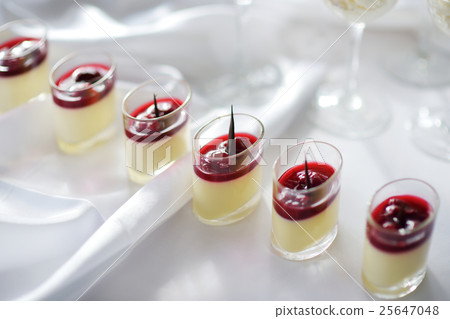 Delicious dessert of cream cheese with cherry Delicious dessert of cream cheese with cherry 25647048
